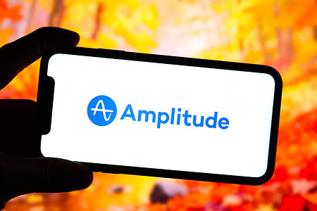 In this photo illustration, the logo of Amplitude is displayed on the screen of a smartphone.