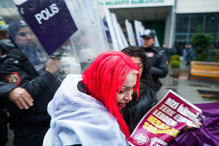 A protester flees the police blockade during the demonstration. Turkish women affiliated with Women's Assemblies gathered at the Ankara Sakarya Square in Istanbul ahead of International Women's Day to call for the resignation of the government over their failure to protect women against femicides and violence. Due to this call, the police imposed the banning of slogans calling the government to resign. The police intervened by not allowing the press statement of the Women's Assemblies and detained dozens of women.