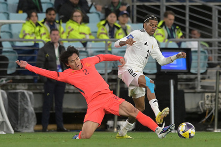 Hu Hetao (L) of China Men football team and Jearl Margaritha (R) of Curaçao Men football team seen in action during the FIFA Series 2026 match between China and Curaçao held at the Accor Stadium. Final score China 2:0 Curaçao.
