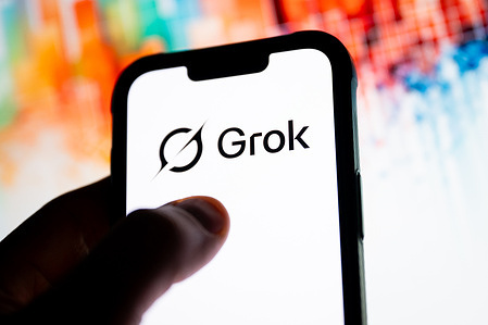 In this photo illustration, a Grok logo seen displayed on a smartphone.