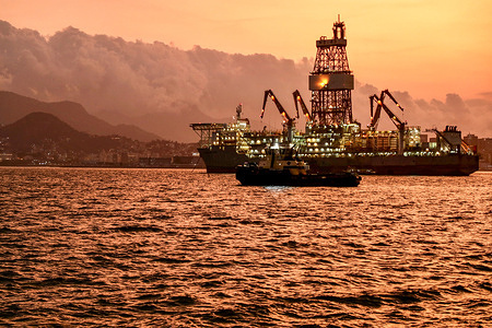 Industrial boats are seen at sunset in Guanabara Bay, Niterói, opposite Rio de Janeiro.