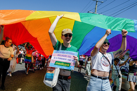 Marchers carry a giant rainbow flag during the the Brisbane Pride March. LGBT community members and allies marched through Brisbane’s West End to Musgrave Park as part of the Brisbane Pride Festival, following two years of cancellations due to the COVID 19 pandemic. Brisbane Pride has celebrated and supported the LGBTIQ+ community for over thirty years.
