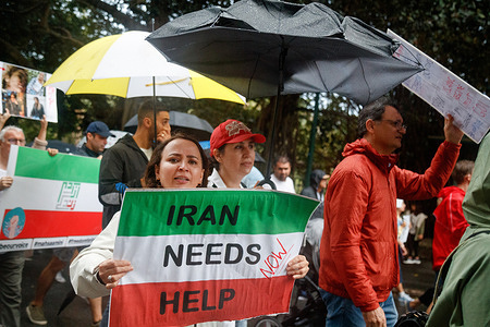 A protester holds a placard while marching through the Streets during a rally calling for freedom in Iran in Brisbane. Demonstrators rallied in Brisbane to call for freedom in Iran, which comes amid international outcry and two weeks of protests in Iran, after the death of 22-year-old woman Mahsa Amini, who was arrested and beaten by members of the Iranian ‘morality police’ for not wearing hijab in Iran. Since protests began in Iran two weeks ago, hundreds of people have been killed with several thousand arrested. The Iranian government has made attempts to curb communication by limiting internet and blocking several social media platforms.