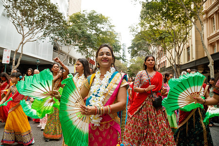 Women take part in traditional dances with bamboo fans during the Festival of Chariots Parade in Brisbane. Originating in Jagannatha Puri, India around 2000 years ago, the Festival Of Chariots or Ratha Yatra is a spiritual celebration of love involving the pulling of hand-drawn carts by the community.