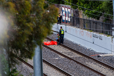 (EDITORS NOTE: Image depicts death)
Police are attending the scene of a dead body under the orange tarp at Ormond Train Station in Mckinnon. Around 5pm AEST a man was hit by express Frankston line train between stations of Ormond and Mckinnon in Inner South-East suburb of Melbourne, Australia. Police, Fire Brigade and Coroner's office attending to scene where the male body is found on the train tracks.
