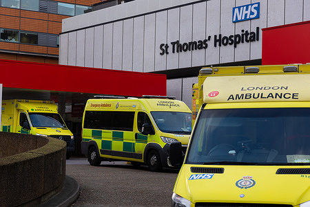 Ambulances belonging to the London Ambulance Service are parked at St. Thomas' Hospital. More than 10,000 NHS ambulance staff from nine NHS hospital trusts in England and Wales will walk out on December 21 in a dispute over pay, the trade union GMB has announced.