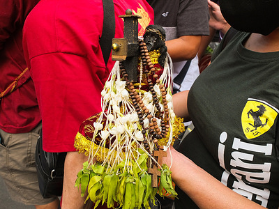 A woman displays her Black Nazarene replica adorned with Sampaguita flowers or the Arabian Jasmine. After two years of COVID-19 pandemic restrictions, Catholic devotees can now participate in the first major celebration of the Black Nazarene feast. Hundreds of thousands of devotees showed up at Quiapo Church and other major streets in Manila to show their devotion to the 17th-century replica of the dark-skinned Jesus Christ.