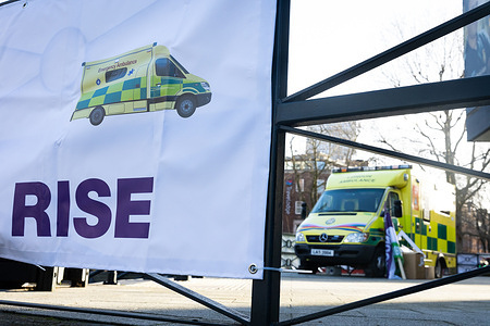 A banner advocating for ambulance workers to receive a pay rise is seen outside Waterloo Ambulance Station. Unison and GMB members of the LAS will walk out for 12 hours from 11am on Wednesday in a dispute over pay.