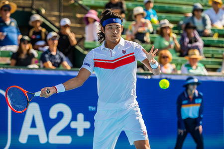 Zhang Zhizhen of China in action during Day 1 of the Kooyong Classic Tennis Tournament last match against Rinky Hijikata of Australia at Kooyong Lawn Tennis Club. Rinky Hijikata won in straight sets 6:1, 7:6.