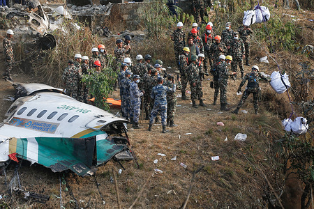 Nepalese Army along with the help of Armed Police force personnel recover the remaining bodies at the Seti River gorge after the crash of domestic Yeti Airlines with 72 people on board dead in Pokhara.