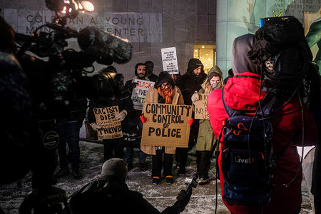Protesters hold placards and chant slogans despite snow, freezing temperatures, and heavy winds during a vigil for Tyre Nichols in solidarity with other protests being held around the country. Protests were held around the country following the release of body cam footage of the arrest and beating of Tyre Nichols in Memphis, Tennessee which led to his death and 5 officers involved being arrested and charged with murder.