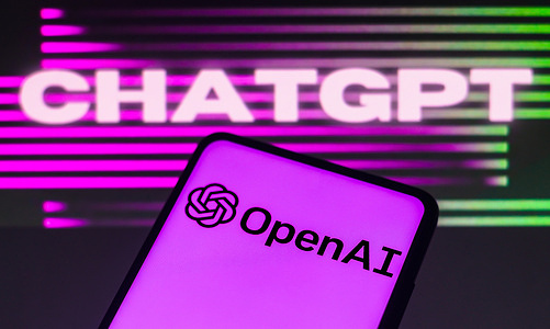 In this photo illustration, the OpenAI logo is displayed on a smartphone screen, ChatGPT in the background.