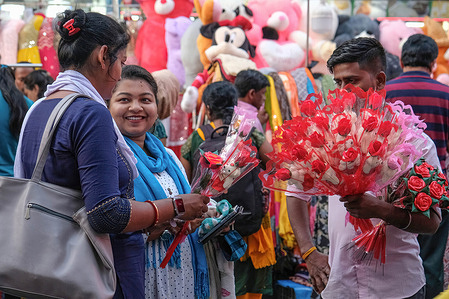People are busy buying flower bouquets ahead of Valentine's day at the new market area.