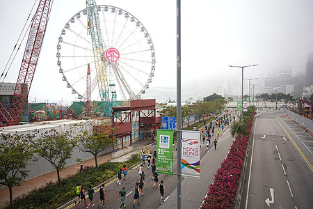 Participants of the Hong Kong Marathon 2023 run past Hong Kong Observation Wheel. More than 34,000 runners joined the Hong Kong Marathon 2023 which consisted of marathon, half marathon, 10km and wheelchair race.