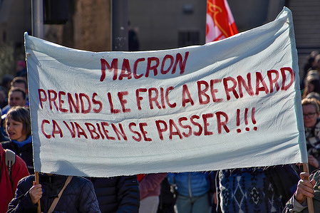 Protesters hold a banner during the demonstration. At the call of several unions and other political organizations, thousands of people marched on the streets of Marseille and everywhere in France to protest against the pension reform wanted by the French government which would postpone the retirement age from 62 to 64 years.