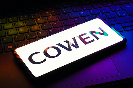 In this photo illustration the Cowen Inc. logo seen displayed on a smartphone.