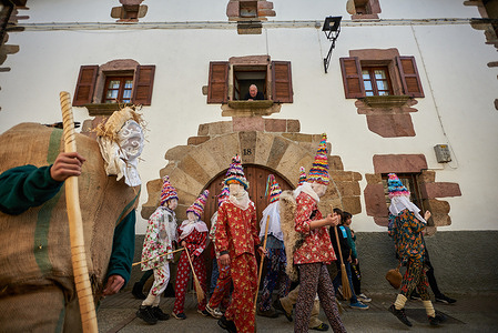 Miel Otxin walks through the streets of the small town in the Pyrenees of Navarra, while the Txatxos, children in colorful costumes, accompany him during the tour. Lanz Carnival, is a festival held in the province of Navarra, where people dress up as Miel Otxin, Ziripot, Zaldiko, and Txatxos, the carnival characters..