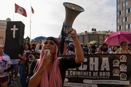 A protester chants slogans through a megaphone during the demonstration. Organizations march in Lima and in other regions to demand faster investigations and justice for transphobic attack victims. To date, at least seven trans women in Peru have been murdered.