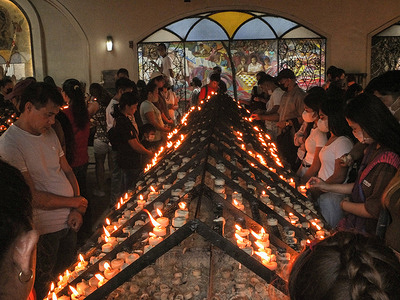 Catholic devotees seen praying at the candle chapel of the Baclaran church. Catholic faithful receive ash markings of the cross on their forehead at the grounds of the Redemptorist Church (also known as Baclaran Church) in the Parañaque City of Metro Manila. It marks the beginning of Lent, the 40-day Lenten period in the Catholic calendar. It is also the time for repentance, reflection, and renewal as a better catholic devotee.
