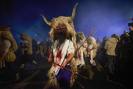 (EDITOR'S NOTE : Image contains graphic content)
The Momotxorro, a character that is half man and half bull. He wears a white clothe with animal blood stains and carries large horns that hang from a basket acting as a head during the carnival of Alsasua. The Carnival involves the Momotxorro, a character of unknown origin, half man and half bull that frightens and "attacks" whoever is in his path.