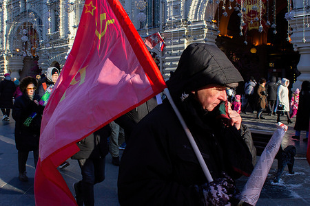 Russian communists march on Nikolskaya street towards the Red Square during the Defender of the Fatherland Day. Russia celebrates Defender of the Fatherland Day annually on Feb 23. The holiday marks the founding of the Red Army in 1918. Originally known as Red Army Day, it was renamed to Defender of the Fatherland day by President Putin in 2002, who declared it a State holiday.