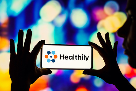 In this photo illustration the Healthily logo seen displayed on a smartphone.