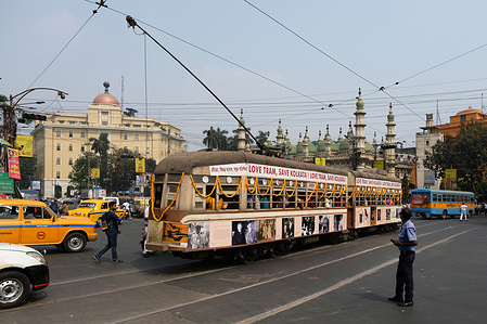 A decorated tram is crossing the busy city traffic. Various tram-lover organizations celebrate 150 years of Tram services in Kolkata. The main theme of the program is to preserve the heritage tram services and promote green mobility and pollution free transport services. According to The West Bengal Transport Corporation (WBTC) website, the first tram, a horse-drawn car, rolled on track on 24th February, 1873. Tram services are on the verge of extinction due to various metro projects and modern traffic routes in the city. Currently, out of 30 tram routes, there are only 3 routes left running.