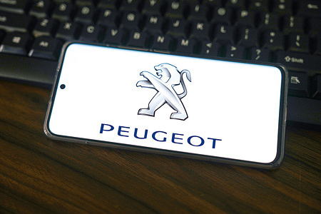 In this photo illustration, a Peugeot logo seen displayed on a smartphone screen.
