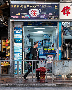 A mask-less man strolls by a specialty mask shop in Shau Kei Wan, Hong Kong. With an estimated 300 specialty mask shops across Hong Kong, the sudden removal of the mask mandate on March 1, 2023 by the Government is expected to free up thousands of square feet of retail space. This doesn't bode well for Hong Kong's economy as the number of retail leases has dropped over the past years, though the return of tourists to Hong Kong may create new economic opportunities.