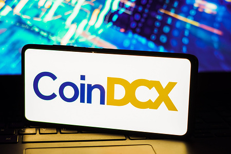 In this photo illustration, the CoinDCX logo seen displayed on a smartphone.
