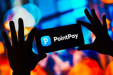In this photo illustration, the PointPay logo seen displayed on a smartphone.