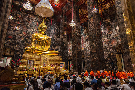 Thai Buddhist monks and Buddhist devotees seen praying in front of a Buddha statue for religious merit during the Makha Bucha day at Wat Suthat. Makha Bucha or Magha Puja also known as the day of the Fourfold Assembly is one of the Buddhist holiest days celebrated on the day that Lord Buddha gave the first sermon on the essence of Buddhism into his ordained 1,250 monk disciples assembled all by spontaneously gathered without an appointment.