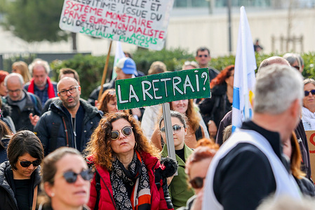 A protester holds a placard expressing her opinion during a demonstration against pension reform. French unions have called for a sixth day of action against the French government's pension reform which would raise the retirement age from 62 to 64. The police estimate, for this 6th day, the number of demonstrators marching in the streets of Marseille at 30,000 and while the unions estimate it at 245,000. The Ministry of the Interior has reported 1.28 million demonstrators in the streets of France, while the unions claim more than 3.5 million.
