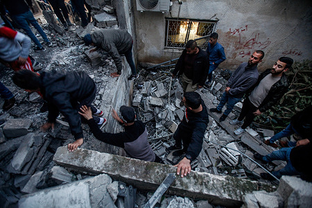 Palestinians inspect a destroyed house, bombed by the Israeli army, in which the Palestinian, Abdel Fattah Khrusha, the perpetrator of the shooting attack on two Israeli settlers in the town of Hawara, was holed up. Large forces of the Israeli army stormed the Jenin camp and destroyed a shelter in which 6 armed Palestinians were holed up, including the Palestinian Abdel-Fattah Khrusheh, who carried out the shooting attack on an Israeli settler in his town, Hawara, on February 28. The Palestinian Ministry of Health said that 6 Palestinians were killed during this raid.
