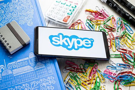 In this photo illustration a Skype logo seen displayed on a smartphone.