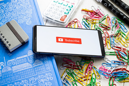 In this photo illustration a Subscribe Button logo seen displayed on a smartphone.