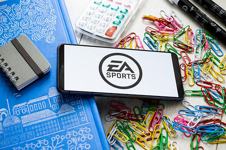 In this photo illustration a EA Sports logo seen displayed on a smartphone.