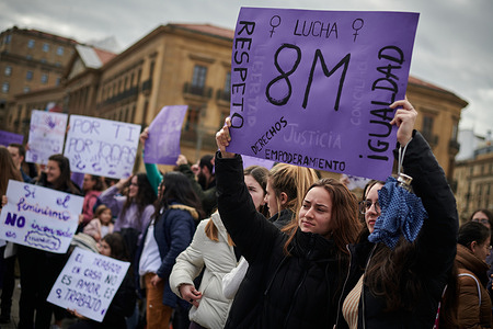 Women hold placards expressing their opinions at Plaza del Castillo during the protest. Protesters demand for the rights of women with disabilities, today March 8, International Women's Day.