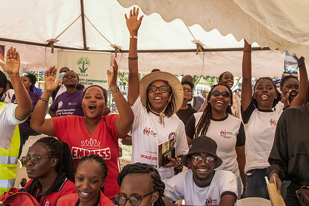 Young women cheer during the celebrations to mark International Women's Day in Nakuru.