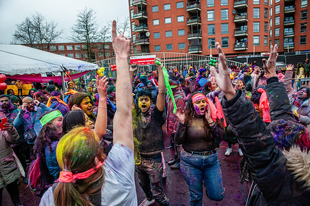 People dance and play with colorful powders during the Holi festival in The Hague. Millions of people around the world celebrate the annual Holi Hangámá Festival. In The Hague, where the largest Indian population in Europe can be found, a big celebration took place in the multicultural Transvaal neighborhood, where participants throw brightly colored powder on themselves and at each other. This celebration also known as the Festival of Colours means the celebration of the arrival of Spring, a new beginning, and the triumph of the divine and the good.
