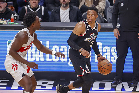 Los Angeles Clippers guard Russell Westbrook (R) is defended by Toronto Raptors forward O.G. Anunoby (L) during an NBA basketball game at Crypto.com Arena in Los Angeles Tuesday, March 8, 2023.