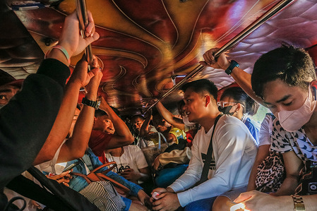 Passengers are seen seated inside of a traditional jeepney. Philippine government is pushing its Public Utility Vehicle Modernization Program (PUVMP) which is to replace traditional jeepneys with modernized versions that adhere to tighter safety and emissions standards. Jeepney drivers and operators resist this initiative, citing the cost of modernizing the ailing vehicles. In comparison to traditional jeepneys, which only cost 150,000 to 250,000 Pesos (2,700 to 4,500 USD), the modernized jeepney will cost about 2 million Pesos (36,000 USD) for each unit. The traditional jeepneys have until the end of this year to operate. The unaffordable modernization expenses and an impending deadline for fleet modernization may disrupt the livelihoods of 10,000 traditional jeepney drivers in the country.