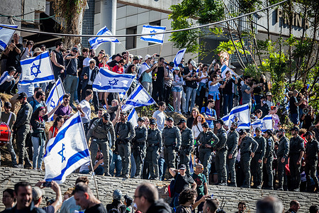 Israeli border police officers form a line preventing protesters from blocking a high way during a demonstration. Tens of thousands of protesters marched in Tel Aviv as a "day of resistance" against the government’s judicial overhaul plans. They blocked the Tel Aviv Ayalon Highway, to stop the traffic to critical industrial and high-tech areas throughout the capital.
