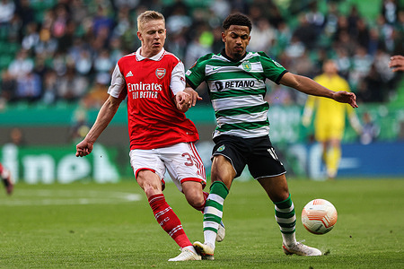 Oleksandr Zinchenko (L) of Arsenal FC with Marcus Edwards (R) of Sporting CP seen in action during the Round of 16 Leg One - UEFA Europa League match between Sporting CP and Arsenal FC at Estadio Jose Alvalade.
(Final score: Sporting CP 2:2 Arsenal FC)