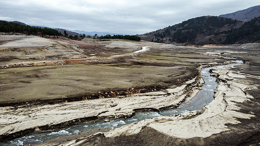 (EDITORS NOTE: Image taken with drone) The 1.47 square kilometer Nilüfer Dam, that provide the drinking water needs of Bursa, which is Turkey's fourth largest city with a population of more than 3 millions people, has almost completely dried up because the region has not received any rain for a while. The dam, with an annual capacity of 60 millions cubic meters of water, was adversely affected by the recent seasonal drought and the water level dropped to zero due to insufficient rainfall. As a precaution, BUSKİ (General Directorate of Turkey) sent a warning message to people in the city to save water. In addition, there were warnings about saving water on billboards in many parts of the city.
