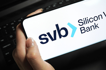 In this photo illustration, a Silicon Valley Bank (svb) logo is displayed on the screen of a smartphone.