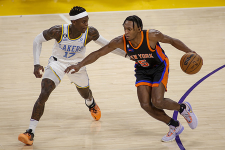 New York Knicks guard Immanuel Quckley (R) drives against Los Angeles Lakers guard Dennis Schroder (L) during an NBA basketball game at Crypto.com Arena. New York Knicks beat Los Angeles Lakers 112-108