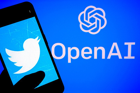In this photo illustration, a Twitter logo is displayed on a smartphone with an OpenAI logo in the background.