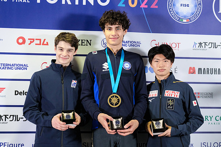 (L) Lucas Broussard of USA (Silver), (C) Nikolaj Memola of Italy (Gold) and (R) Nozomu Yoshioka of Japan (Bronze) pose with their medals in the Junior Men during the ISU Grand Prix of Figure Skating Final Turin at Palavela.