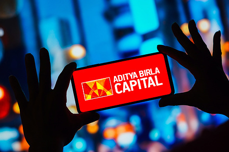 In this photo illustration, the Aditya Birla Capital logo seen displayed on a smartphone.